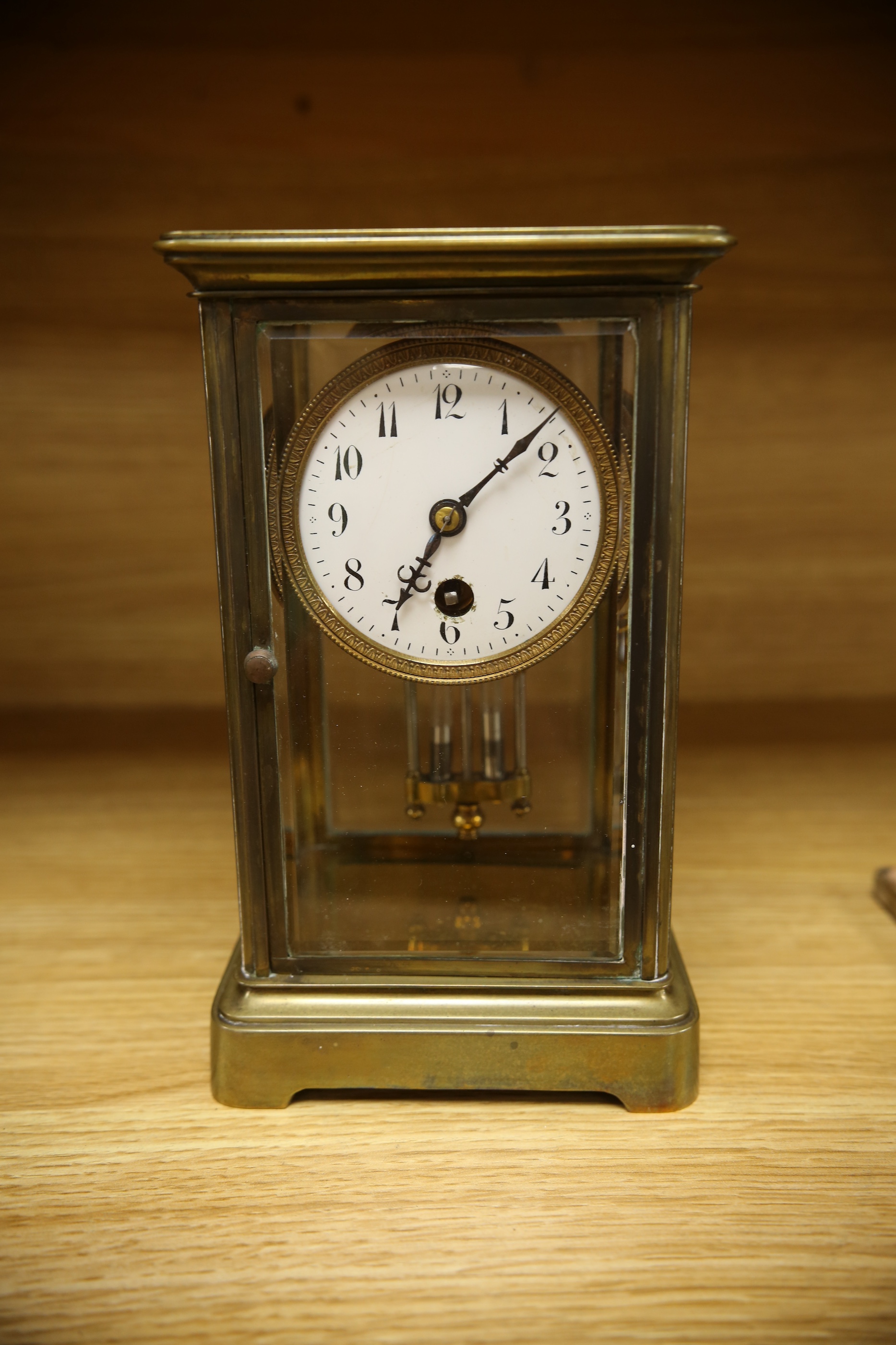 An early 20th century brass four glass mantel clock, 22cm. Condition - fair, not tested as working